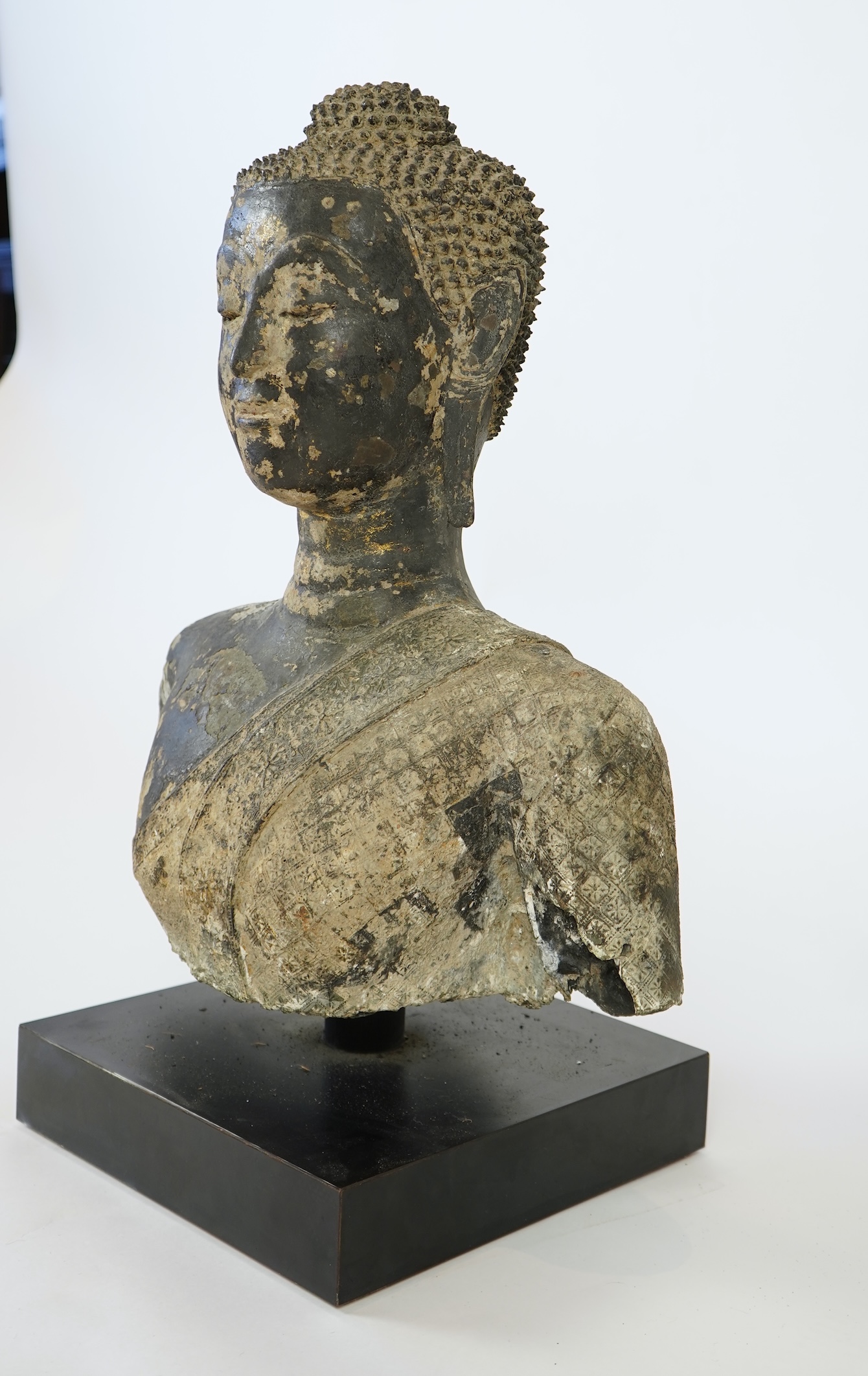 A large Thai lacquered bronze bust of Buddha, 17th/18th century
